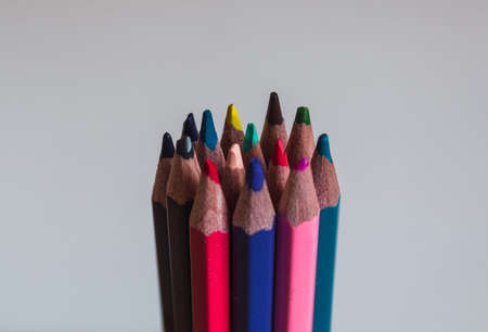 Close-up of colorful wooden pencils on the desk. Back to school concept