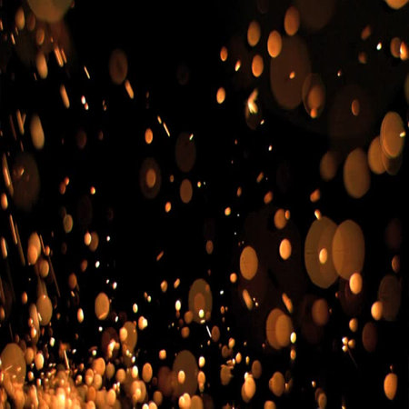 Flame of fire with sparks on a black background. Gold sparks fly in the air.のイラスト素材