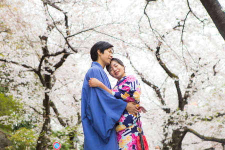 Tokyo, Japan- March 29,2019 an asian couple wearing traditional japanese clothes in blooming cherry blossom festival Tokyo,Japanのeditorial素材
