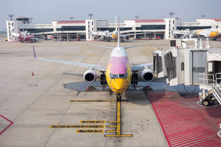 Bangkok, Thailand April  15, 2020 : airplane link with airport ramp service   in bangkok airport,...