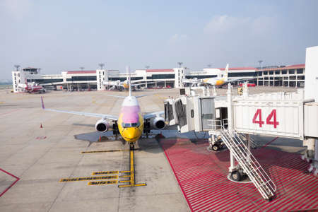 Bangkok, Thailand April  15, 2020 : airplane link with airport ramp service   in bangkok airport, Don mueang Thailandのeditorial素材