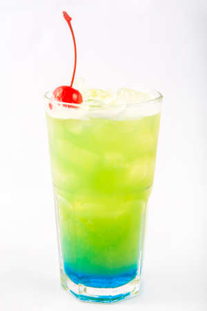 green with a blue bottom drink in a tall glassの写真素材