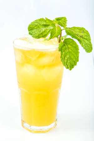 iced yellow drink in a tall glassの写真素材