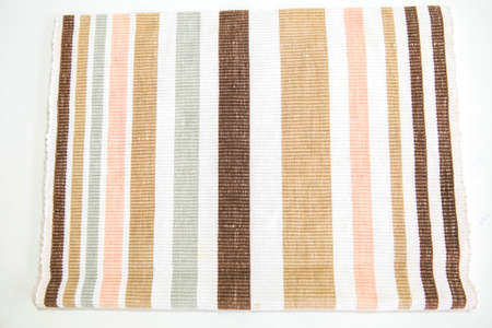 striped pattern placemat brown white pink gray on white backgroundの写真素材