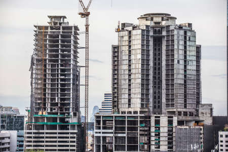 Bangkok, Thailand - 7 August, 2020 two high buildings are under construction in developing country