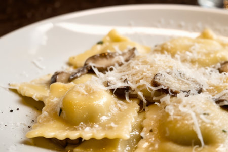 Close-up of homemade mushroom ravioli with truffle oil and grated Parmesan cheese on top, AI Generatedの素材
