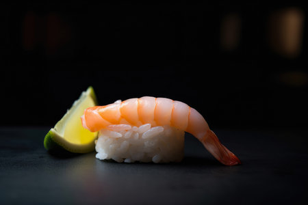 Mouthwatering macro shot of a shrimp nigiri sushi with a slice of lemon on top, AI Generatedの素材
