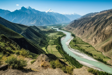 Breathtaking View stunning view of a mountain range from a high altitude with a bird's eye view of a meandering river and dense forests, AI Generatedの素材