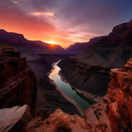 Sunset over a majestic rocky canyon with winding rivers reflecting the warm hues of the sky, AI Generatedの素材
