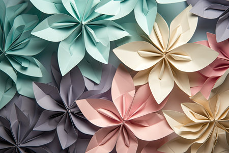 Origami flowers in pastel colors arranged in a symmetrical pattern on a gradient backgroundの素材