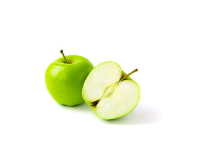 ripe green apple with half isolated white backgroundの写真素材