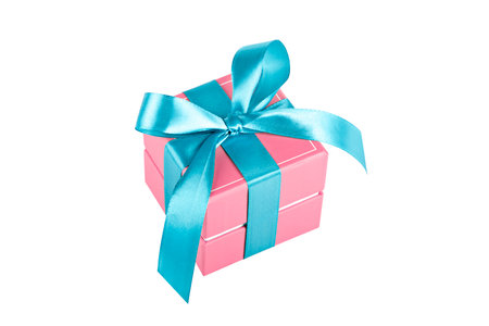 pink gift with blue ribbon and bow isolateの写真素材