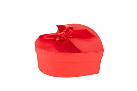 red heart shaped gift box with red bow isolatedの写真素材