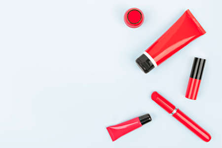 on a gray background cosmetics in a red caseの写真素材