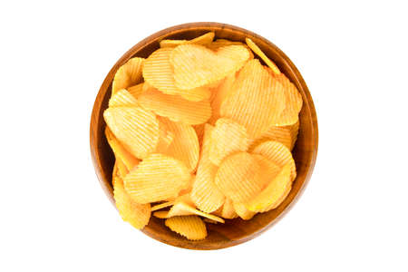 Chips in a wooden brown cup of isolatedの写真素材