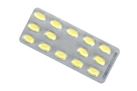 plate of yellow medical pills isolatedの写真素材