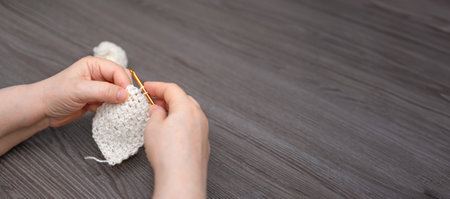 female hands knitting close up.