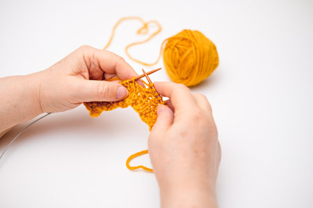 female hands knitting close up.