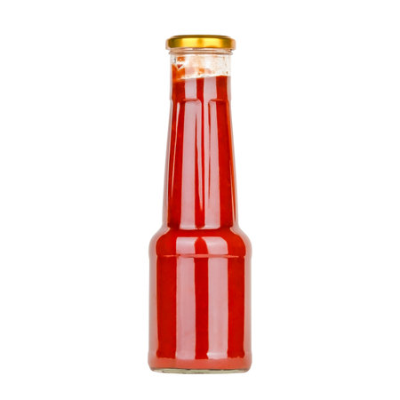 glass bottle of ketchup isolated on white background.の写真素材