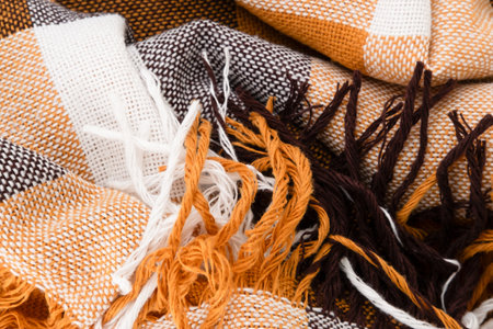 background checkered plaid sulfur, brown with white fabric close-up.の写真素材