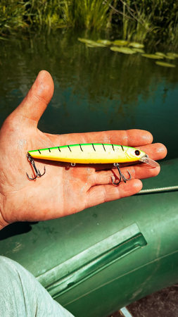 Fishing Lure in Hand Outdoorsの写真素材