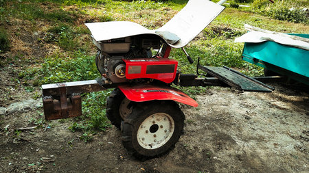 Red Garden Tiller Machine Outdoors.の写真素材