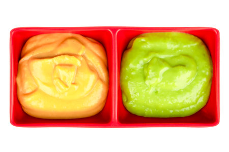 Wasabi and mustard sauce isolated on a white background.