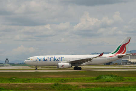 Kuala Lumpur Internal Airport, Malaysia, 25th Feb 2017, Sri Lankan Air aircraft on a taxi way at the airport with MAS Kargo building and few parked aircraft  in the backgroundのeditorial素材