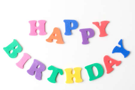 text happy birthday formed with kids foam lettersの写真素材
