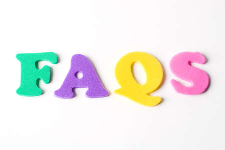 acronym for frequently asked questions formed with multicolor foam lettesの写真素材