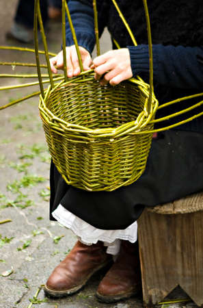 Woman´s hands making a wood basketの写真素材