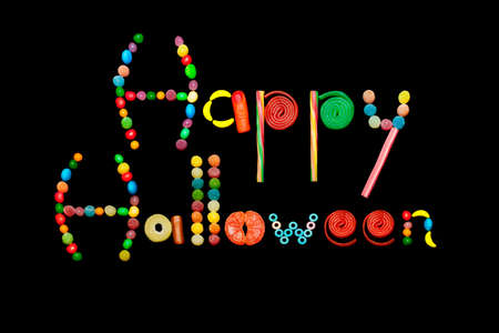 Text with multicolor candies on black backgroundの写真素材