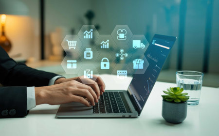 Business Analytics and Digital Supply Chain Dashboard on Laptop with Futuristic Iconsの素材