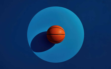Minimalist Still Life of Basketball Casting Shadow on Blue Backgroundの素材