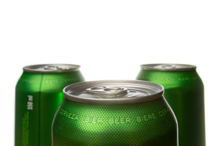 Three green cans of beer. Background for a pub. Beer store. Relax at the weekend. Summer with beer. Low alcohol percentage. Packaging and ecology. White background.の写真素材