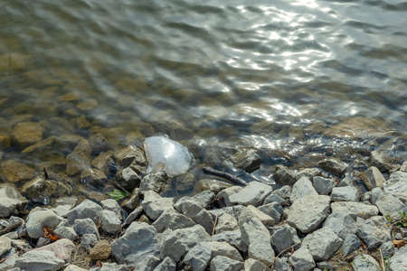 Plastic packaging in the natural environment. Empty used dirty plastic bottles. Environmental pollution. Used plastic waste packaging. Environmental Protection. Take care of nature.の写真素材