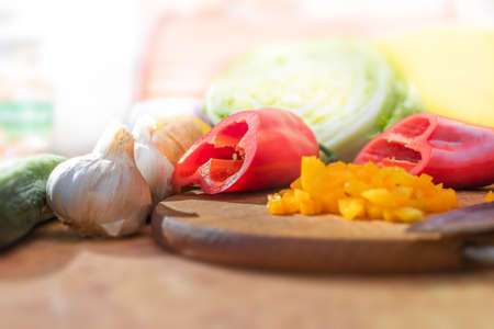 Sweet pepper, garlic and other vegetables on the table. Bright lightの写真素材