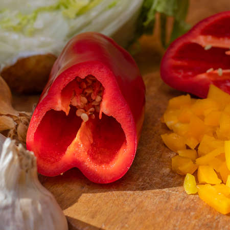 Sliced bell pepper. Red and yellow peppers on the tableの写真素材