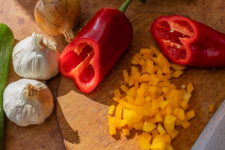 Sliced peppers and other vegetables. Garlic, onion and cucumberの写真素材