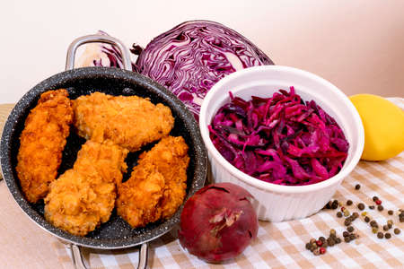 Red cabbage salad. Red vegetables. Cabbage head. Healthy meals. Salad bowl. Vitamin Table. Addition to dinner. Vegan flavors. Vegetables for salad. Crispy chicken. Warm, spicy snacks.の写真素材