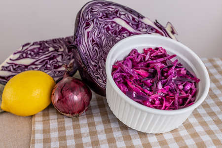 Red cabbage salad. Red vegetables. Cabbage head. Healthy meals. Salad bowl. Vitamin Table. Addition to dinner. Vegan flavors. Vegetables for salad.の写真素材