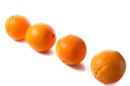 Oranges on a white background. Slice oranges.の写真素材