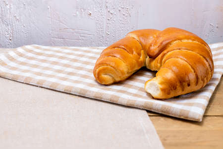 Croissant on a rustic background. Bread for breakfast. Polish treats shortbread. A delicious morning.の写真素材