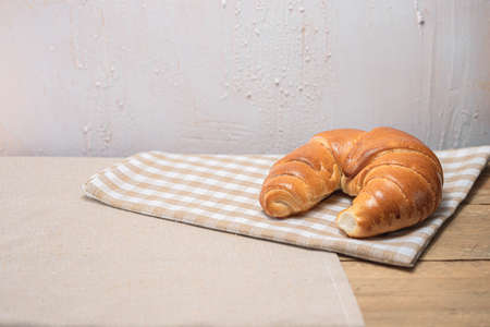 Croissant for breakfast and bright background. Polish pastries. Shopping at the bakery. Buns from the bakery.の写真素材