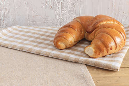 Croissant for breakfast and bright background. Polish pastries. Shopping at the bakery. Buns from the bakery.の写真素材