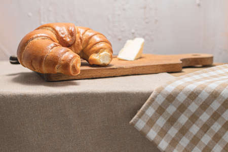 Croissant, butter for breakfast. Breakfast on a rustic table. A rural meal. Bakery products. Polish pastries.の写真素材