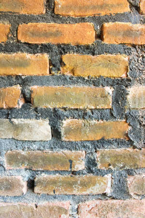 Photo of the wall surface of the house from a pile of bricksの写真素材