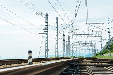 railway tracks with electric trains for trains at day timeの写真素材