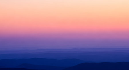 Mountain landscape with fog at sunset. View from the top.の素材
