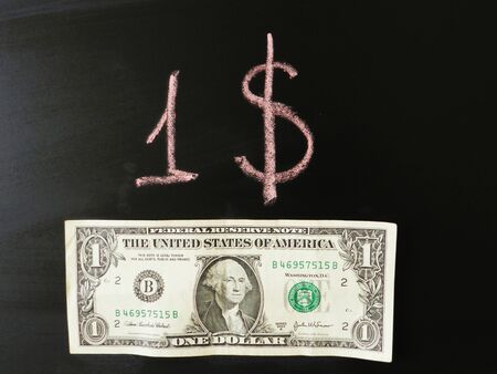 One dollar banknote on the black backgroundの写真素材